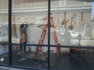 Bart Hopkin installing his exhibit of experimental musical instruments, curated by Thingamajigs